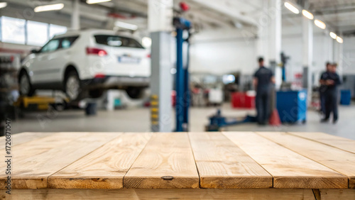 Wallpaper Mural Busy auto repair shop with mechanics working on vehicles and equipment in the background Torontodigital.ca