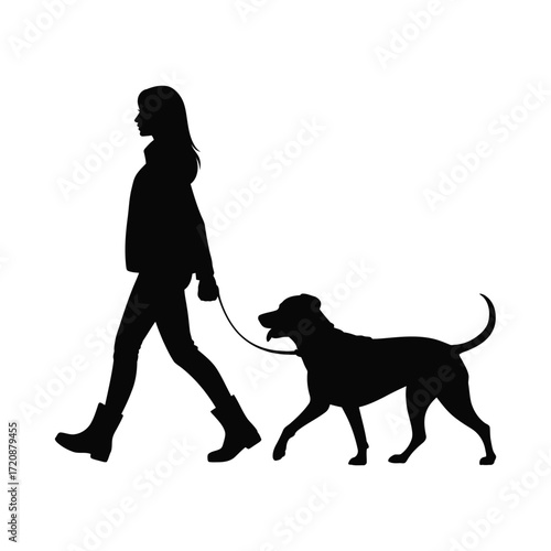 Silhouette of a woman walking her dog on a leash