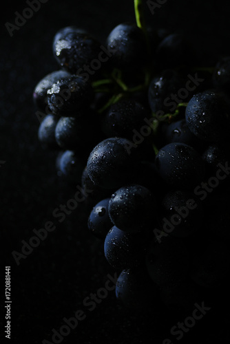 Fresh black grapes close up, organic fruit, healthy food
