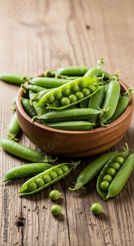 Fresh Green Peas in Bowl on Wooden Table.