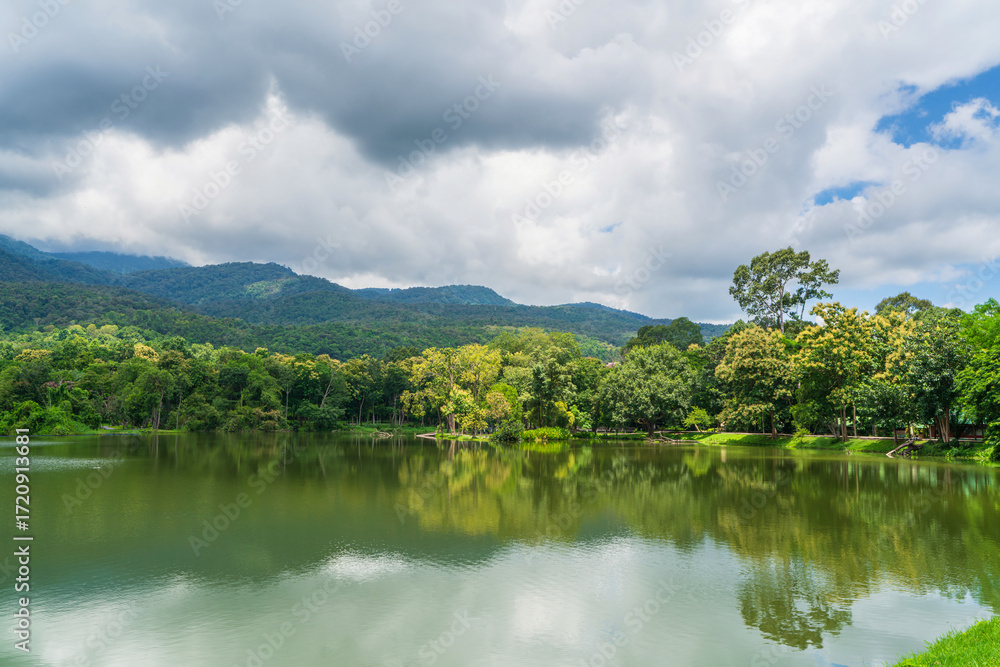Fototapeta premium a public place leisure travel landscape lake views at Ang Kaew Chiang Mai University and Doi Suthep nature forest Mountain views spring cloudy sky background with white cloud.