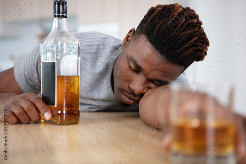alcohol addicted man sleeping at the table
