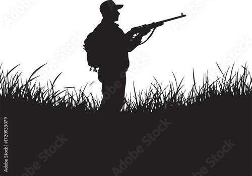 Hunter Silhouette with Rifle in Grassy Field