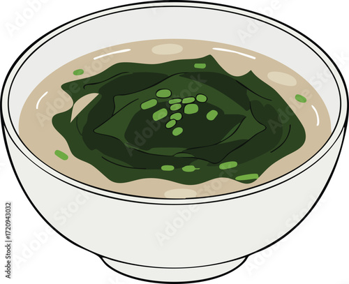 A bowl of miso soup with seaweed and chopped green onions.