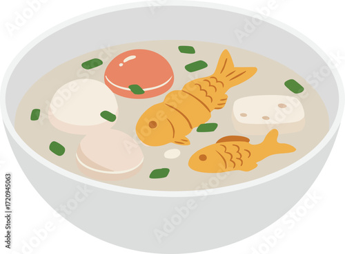 Bowl of Korean rice cake soup (tteokguk) with fish-shaped cakes.