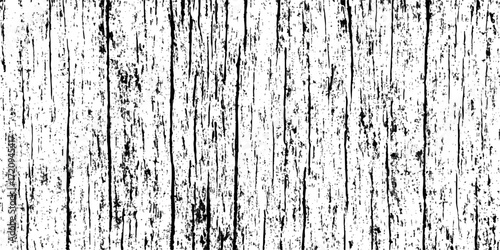 Peeling brown paint reveals a weathered wood texture on a grungy old wall