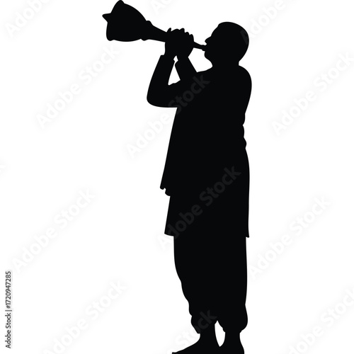 Silhouette of a man playing a wind instrument standing against a plain white background in a studio shot