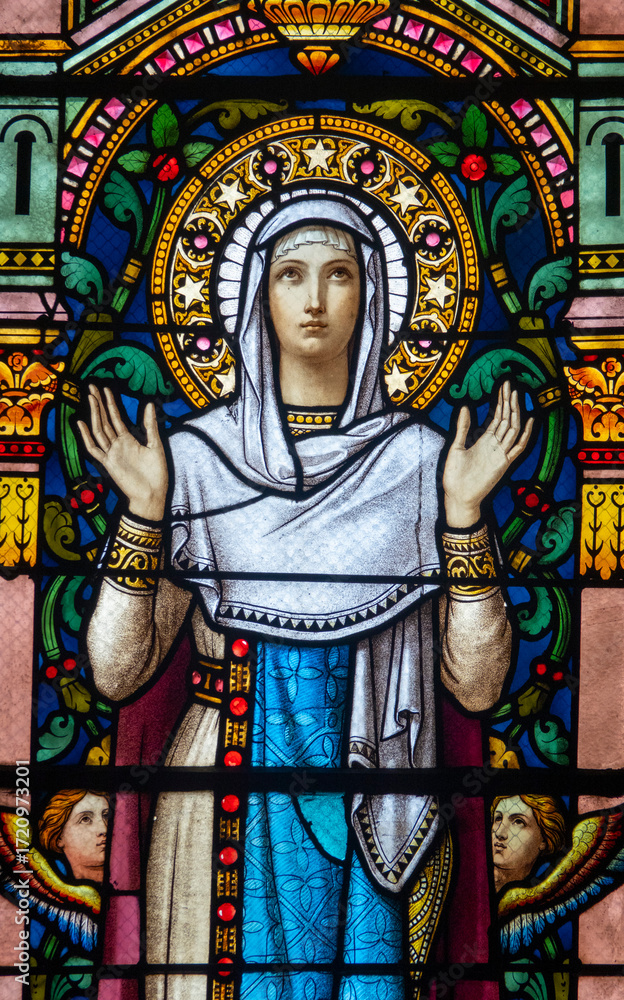 Fototapeta premium Stained glass (19th century) of Virgin Mary at prayer.
