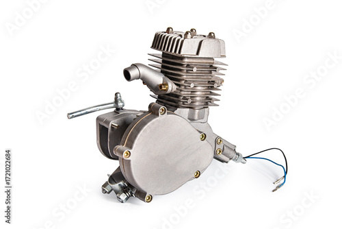 Two-stroke bicycle engine. Two-stroke bicycle engine. Gasoline engine of moped isolated on white background.