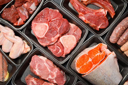 Konstfotografi Black plastic packaging trays from supermarket with different types of fresh raw