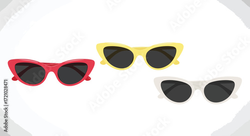 Three colorful cat-eye sunglasses in red, yellow, and white, displayed on a plain background.