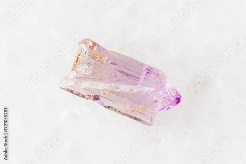 sample of raw purple scapolite crystal on white
