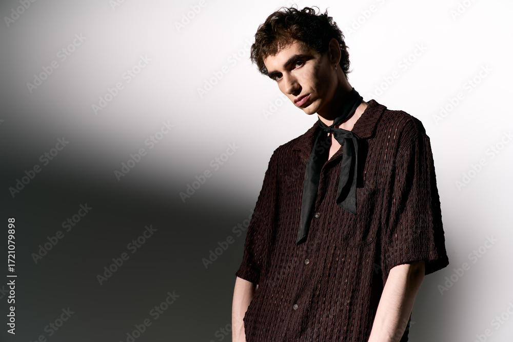 Obraz premium Handsome young man showcases stylish attire with confidence in a modern setting