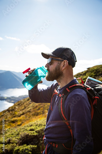 Thirsty hiker drinking water