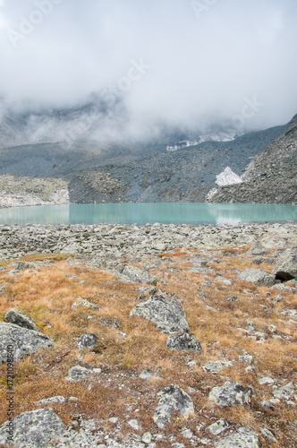 View of Upper Akchan lake in late august, glacial lake located in the Altai mountains, Russian Federation