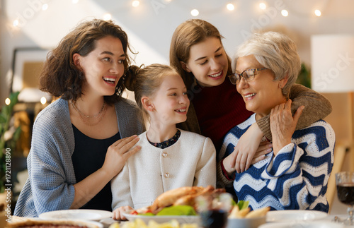 Family celebrating Thanksgiving Day