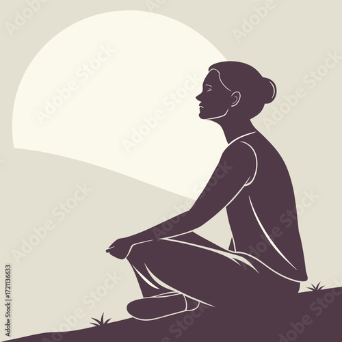 Silhouette of a woman meditating peacefully under a large full moon