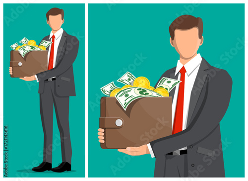 Man entrepreneur holding wallet full of money. Big cash income and financial profit concept. Business wealth investment success.
