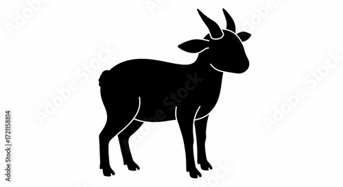Silhouette of a majestic antelope with large horns standing confidently outdoors