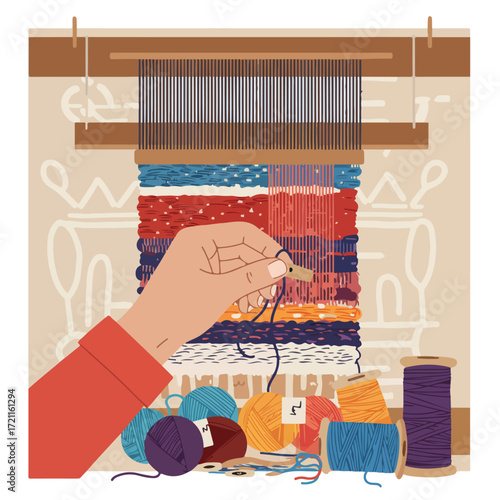 Weaving on a loom with hand, colorful yarns, and spools of thread