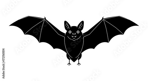 Dark silhouette of a flying bat with wings spread wide during nocturnal flight