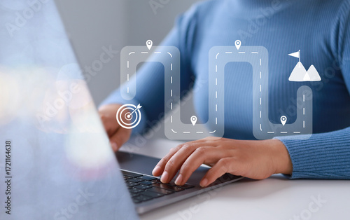 Businesswoman touching virtual screen on computer screen. Project planning or strategy process. Destination point icon and end with goal achievement.