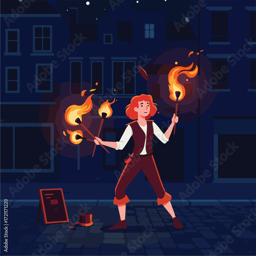 Fire performer juggles flaming torches on a cobblestone street at night