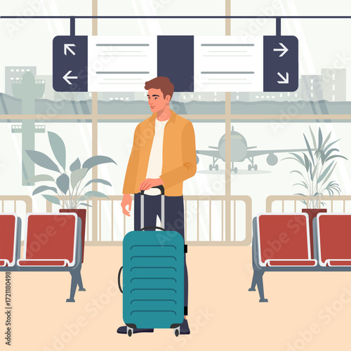 Young male traveler with suitcase standing in airport terminal with planes and seating area visible
