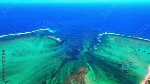 Aerial view of Mauritius island and Le Morne Brabant mountain with beautiful blue lagoon and underwater waterfall illusion background
