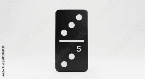 Dominos games concept featuring black domino tile showing 5 and 2 spots in minimal studio setting