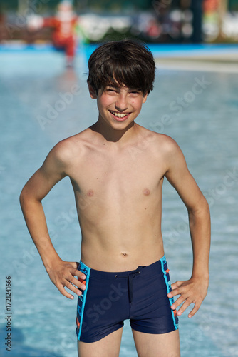 Happy boy enjoys cool summer day at water park
