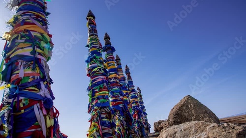 Timelapse Shamanic Pillars with Colored Ribbons on Olkhon Island on Lake Baikal in Siberia, Russia