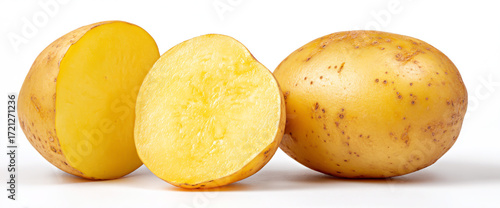 Whole and halved potatoes isolated on white background