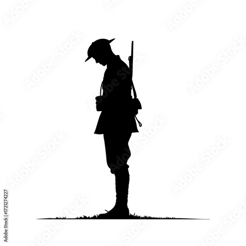 Soldier silhouette standing with head down in a reflective pose  