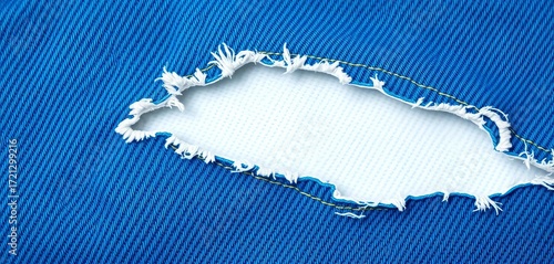 Frayed edges of blue denim, revealing white cotton underneath, textured background,  hole,  blue denim