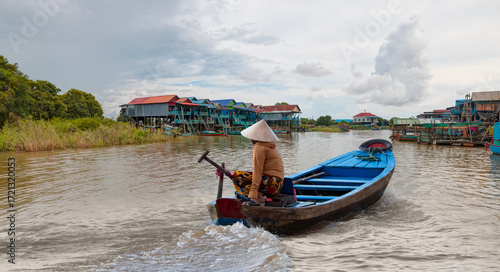 Wallpaper Mural Tonle Sap lake, Siem reap Province, Cambodia. Fisherman in his boat, Floating village of Kompong Phluk, Cambodia. Torontodigital.ca