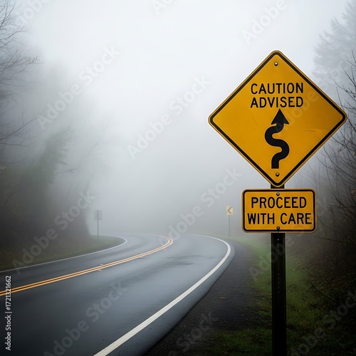 A winding road through a thick fog, caution advised, proceeds with care.