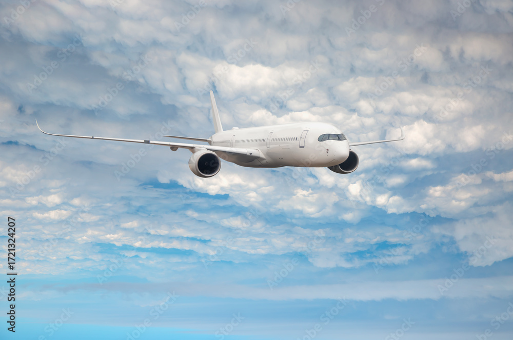 Obraz premium White passenger airplane flying in the sky amazing clouds in the background - Travel by air transport
