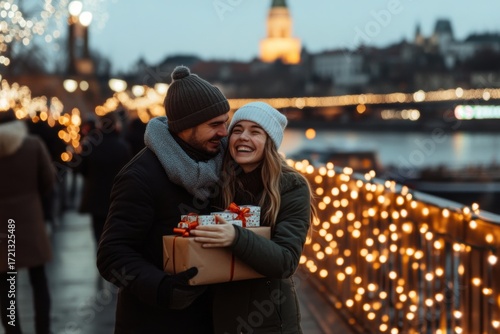Happy couple exchanging Christmas gifts in city lights