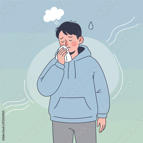 Young man wiping nose while feeling unwell in pastel background  
