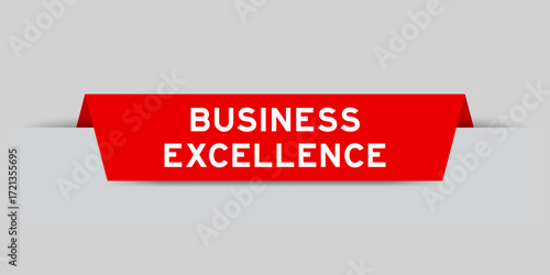 Red color inserted label with word business excellence on gray background