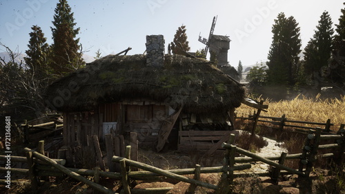 Photos An old, abandoned hut with a thatched roof stands amid tall trees and golden crops under clear skies