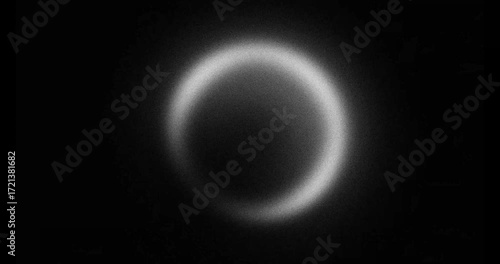 abstract black and white pulsating gradient ring, looping animation on dark background	
