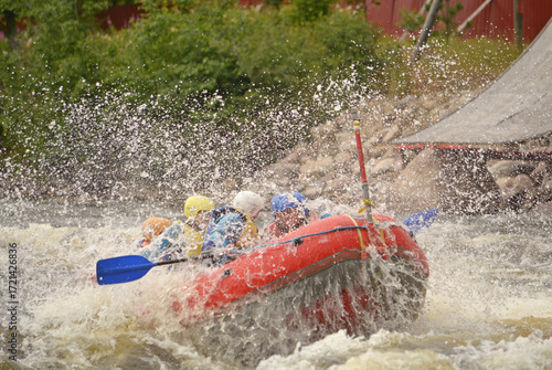 Athletes raft down a turbulent river