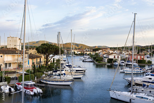 Port Grimaud marina in France in spring with yachts and sailing boats, french riviera