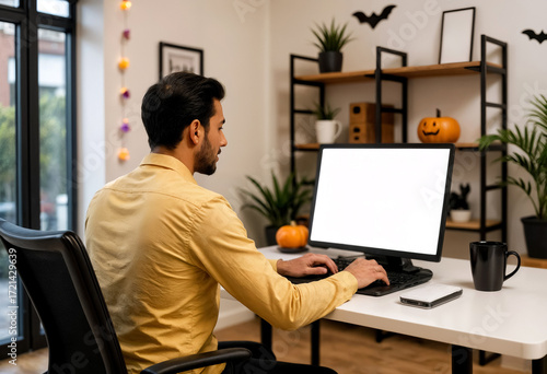 Wallpaper Mural man working on a computer in a room decorated for halloween, monitor mockup Torontodigital.ca