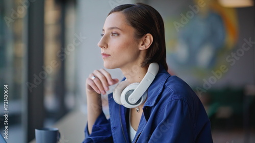 Pensive entrepreneur drinking coffee thinking on business at cafeteria closeup.