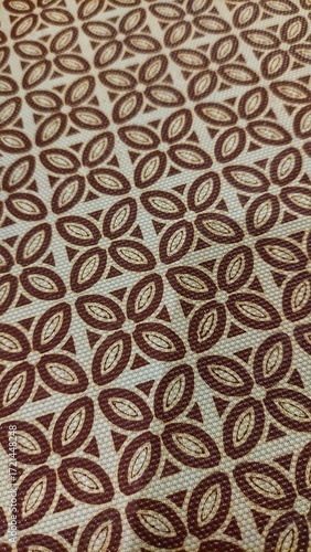 This is a close-up photo of a textured fabric or surface with a repeating pattern.