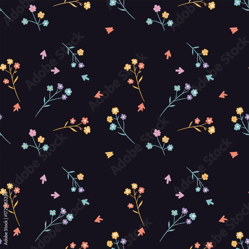 Delicate pastel wildflowers scattered on a dark indigo background.