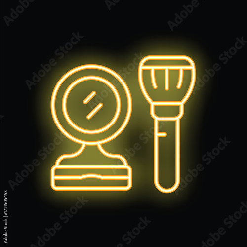 Neon sign of makeup brush and hand mirror glowing yellow on black background